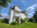 Ansicht vom Garten - Mit Einbauküche, schöner Terrasse und Gartenanteil. Helle Erdgeschosswohnung in Lautertal