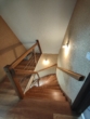Treppe ins Obergeschoss - Ein stilvolles Zuhause mit modernem Komfort und großem Garten