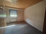 Zimmer Erdgeschoss - Großzügiges Wohnen mit Einliegerbereich, zwei große Terrassen, Wintergarten, Sauna und Doppelgarage